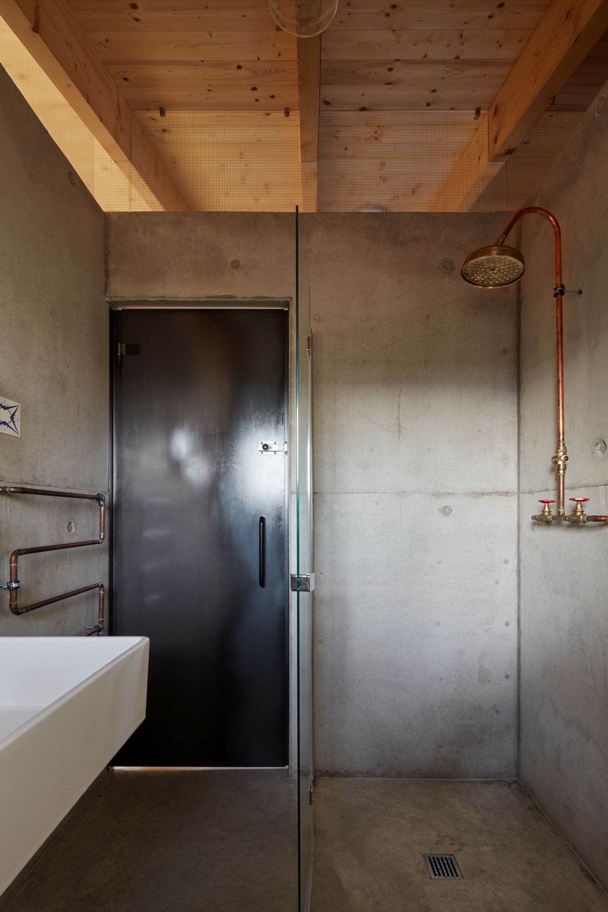 There's definitely a stronger industrial vibe in spaces like this bathroom compared to some of the other rooms