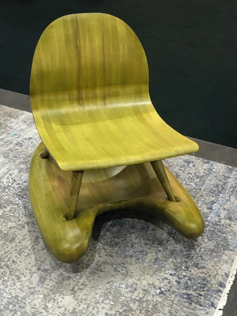 The unexpected color and organic shape of the base make this rocker distinctive.