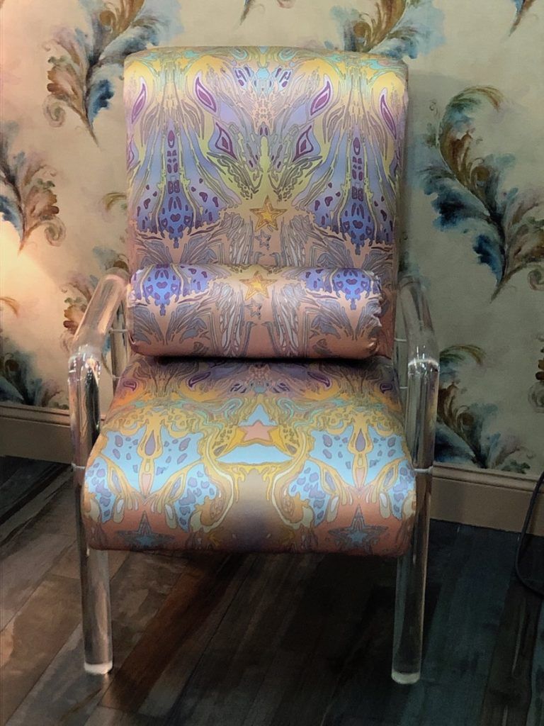 Lucite and a fantastical pastel textile create a very feminine chair.