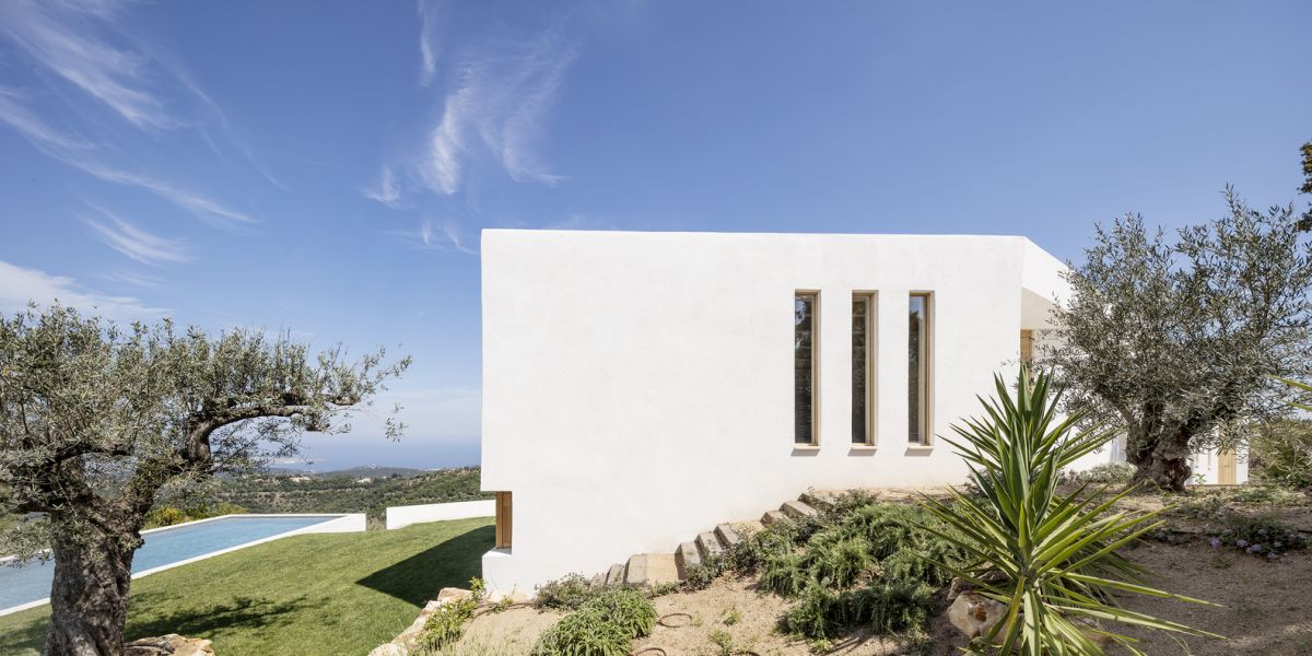 The sloping terrain allows the house to transition from a single floor structure to a two-storey home very seamlessly