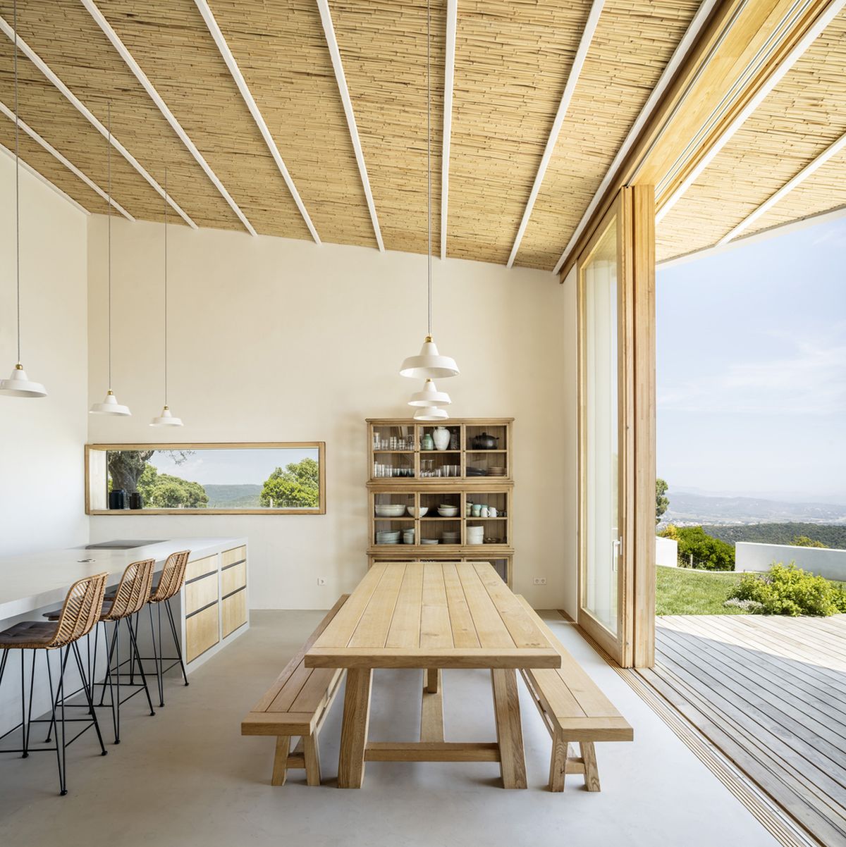 The kitchen and dining area share an open plan and are directly connected to the outdoors