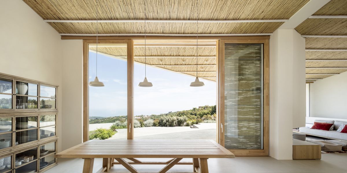 The sliding glass doors ensure a smooth and seamless transition between the interior spaces and the deck