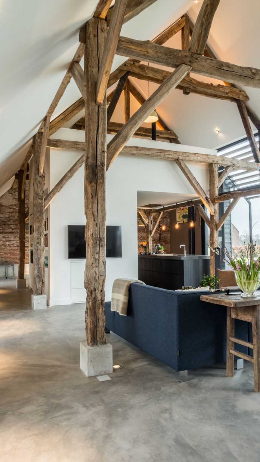 The high ceiling and exposed wooden beams are a wonderful combination which gives the living area lots of character