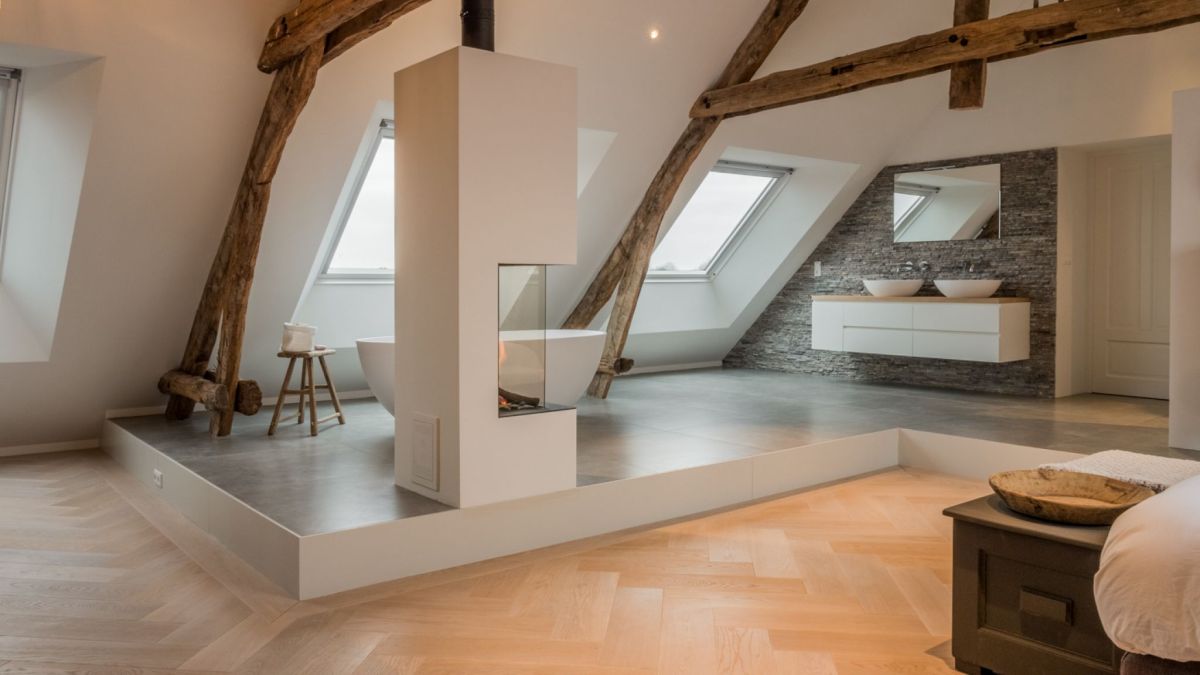 The original shape of the roof was preserved, giving the upstairs area a really cozy look
